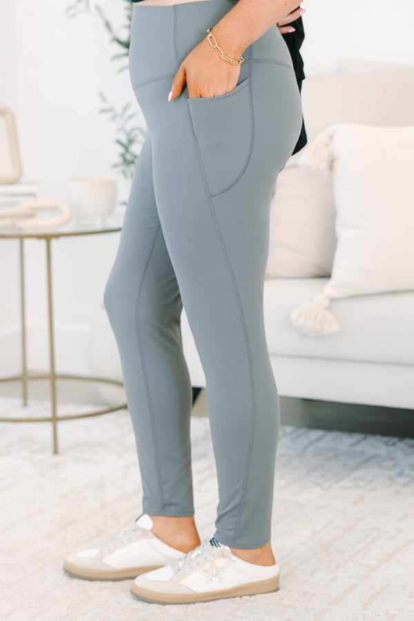 Plus size charcoal grey leggings in a stretchy nylon-spandex blend with a high-waisted fit.