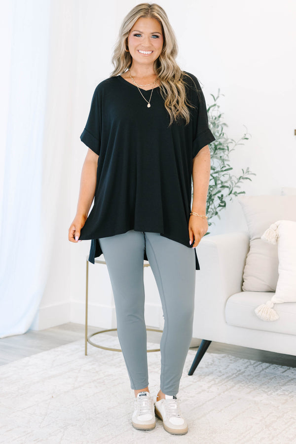 Plus size charcoal grey leggings in a stretchy nylon-spandex blend with a high-waisted fit.