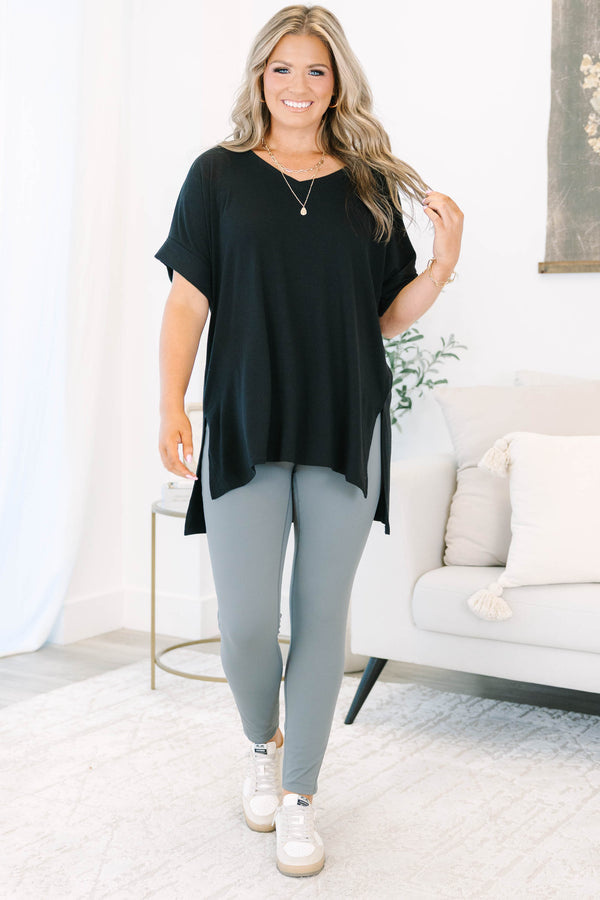 Plus size charcoal grey leggings in a stretchy nylon-spandex blend with a high-waisted fit.