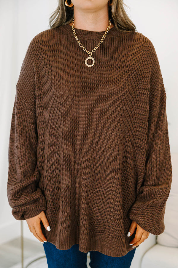 Plus size brown, oversized knit sweater with a crew neck and relaxed, flowy fit.