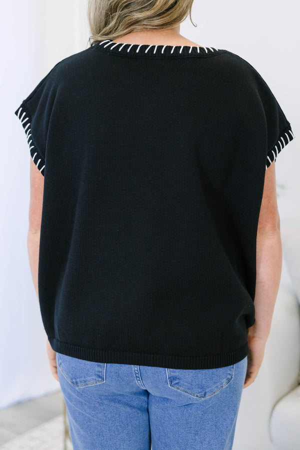 Plus Size black short sleeve knit top with white whipstitch detailing on the neckline and sleeves.