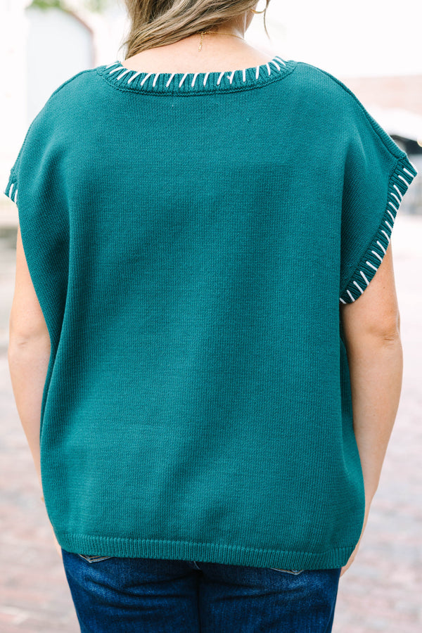 Plus Size hunter green cap sleeve knit top with white blanket stitching on the neckline and arms.