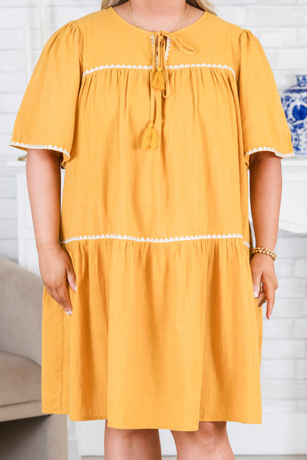 Chic Soul plus size clothing, short-sleeve mustard yellow ruffled short dress with white scalloped embroidery detailing along dress and sleeves with tassels on the neckline