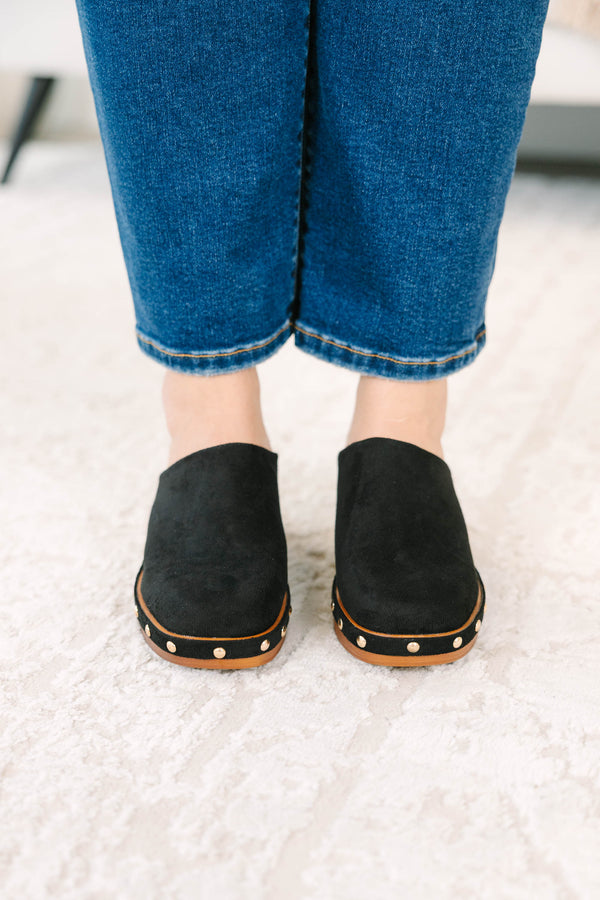 Slip-on, closed-toe block-heel clog featuring a chunky platform base, metal stud details