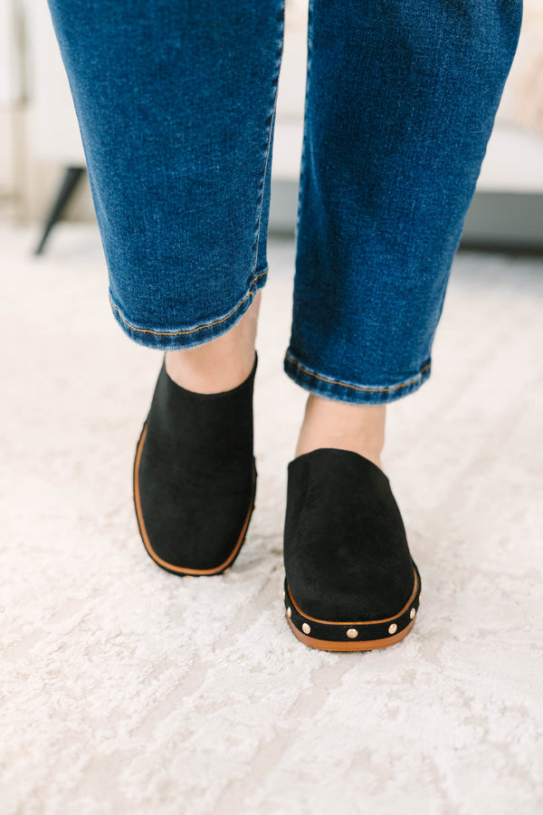 Slip-on, closed-toe block-heel clog featuring a chunky platform base, metal stud details