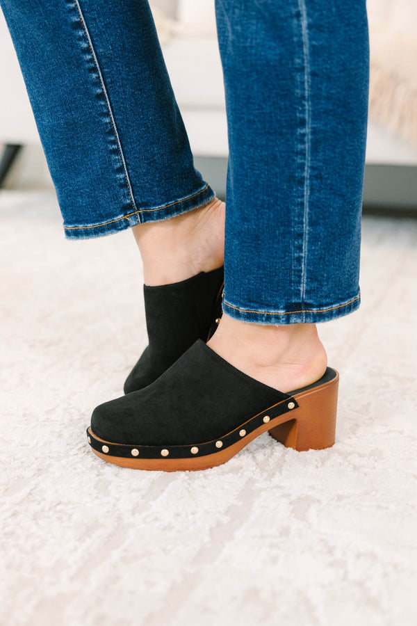 Slip-on, closed-toe block-heel clog featuring a chunky platform base, metal stud details