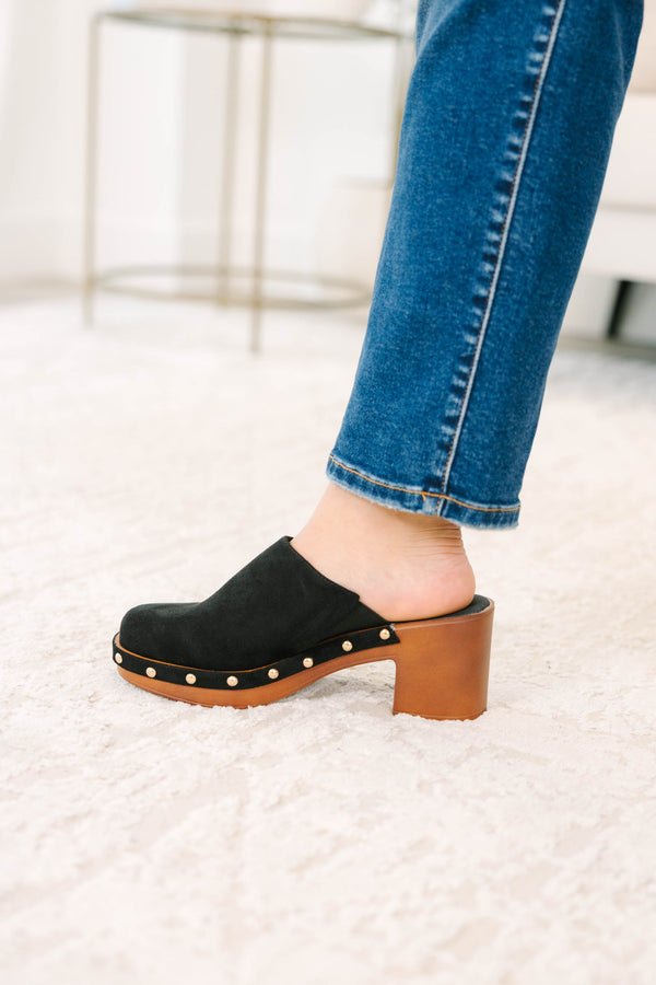 Slip-on, closed-toe block-heel clog featuring a chunky platform base, metal stud details