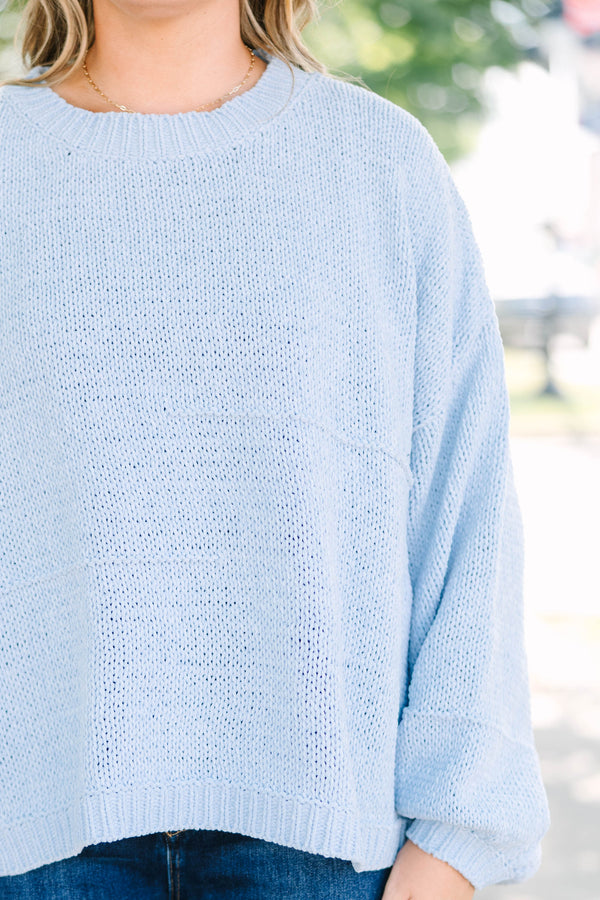 Plus Size light blue oversized knit sweater with a crew neckline and long balloon sleeves.