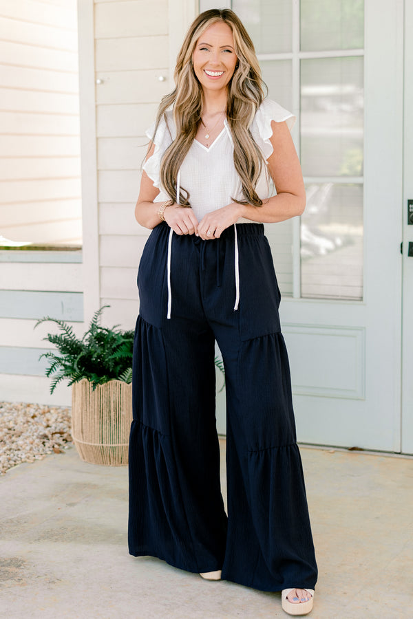 Chic Soul plus size clothing, high-waisted navy blue ruffled flowy pants with an elastic waistband 