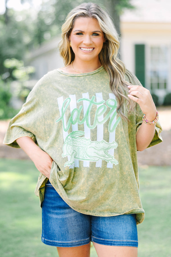 Plus size golden olive acid wash relaxed tee with a green alligator graphic.