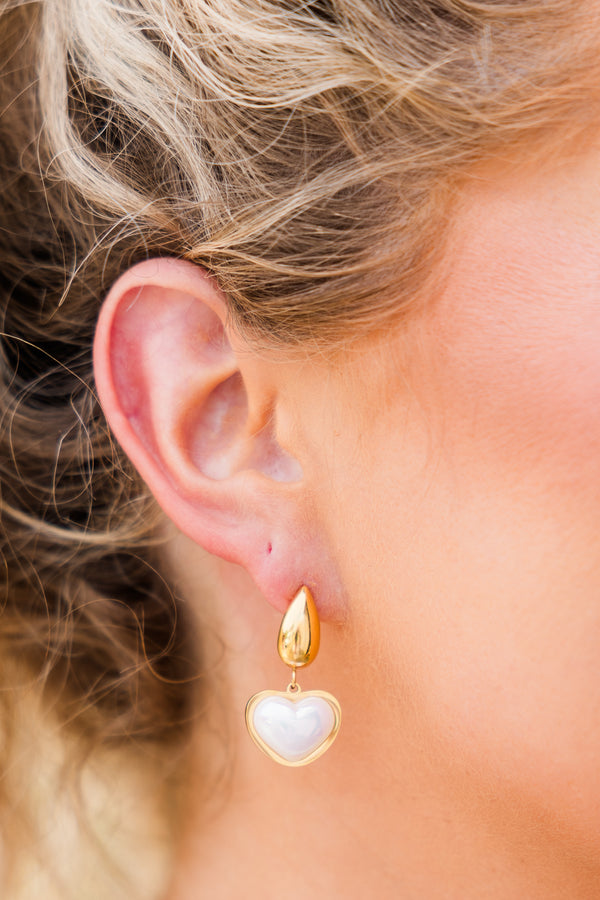 Chic Soul plus size clothing, thick teardrop shaped gold earring with a dangling pearl in the shape of a heart 