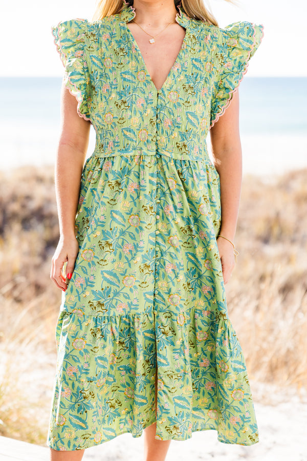 Chic Soul plus size clothing, short-flutter-sleeve green midi dress with a smocked bodice and a tiered skirt with a buttoned detailing down the front and a pink ric rac piping with a green tropical floral print pattern