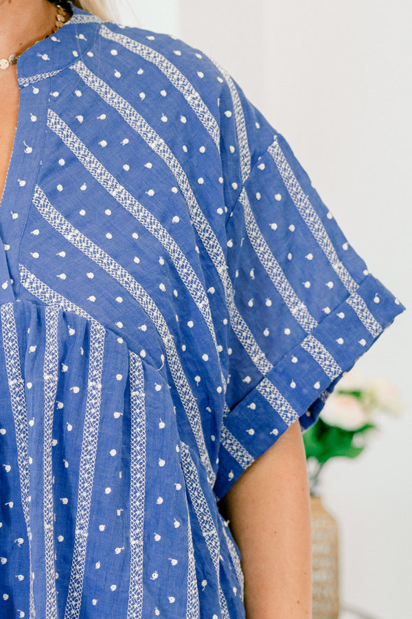 Chic Soul plus size clothing,  blue short sleeve flowy top with a polka dot and striped pattern as well as a ruffle detail at the bottom of the shirt 

