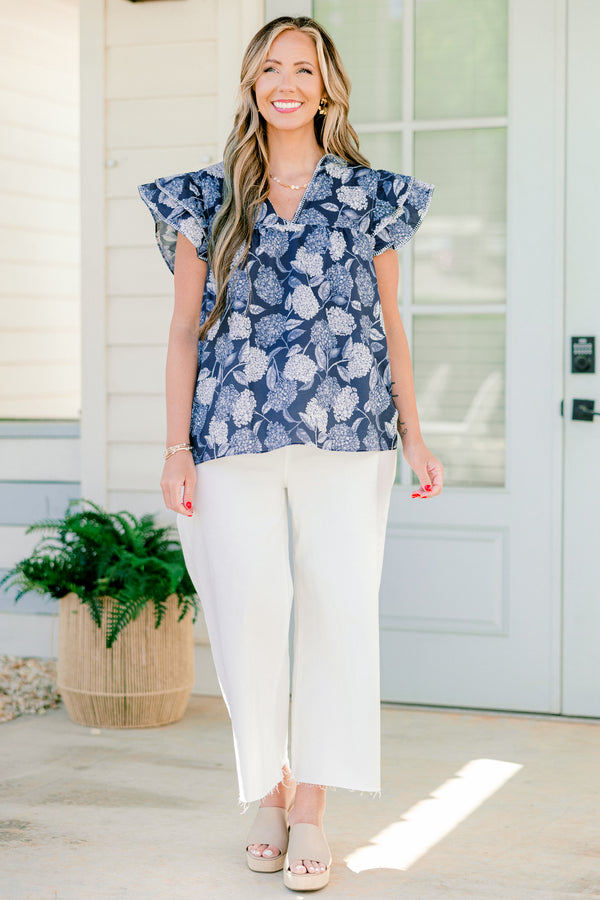   Chic soul plus size clothing, navy and white top with a hydrangea pattern and flutter sleeves 
