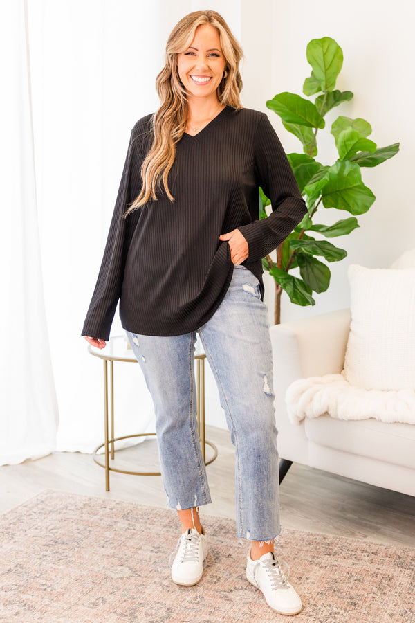 Plus Size black ribbed long sleeve top with a v-neckline and a relaxed fit.