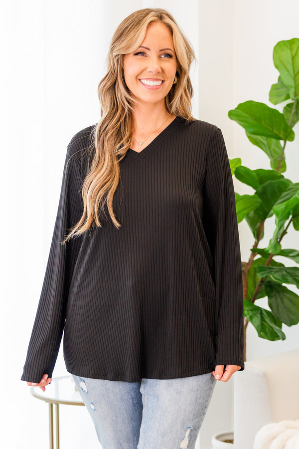 Plus Size black ribbed long sleeve top with a v-neckline and a relaxed fit.