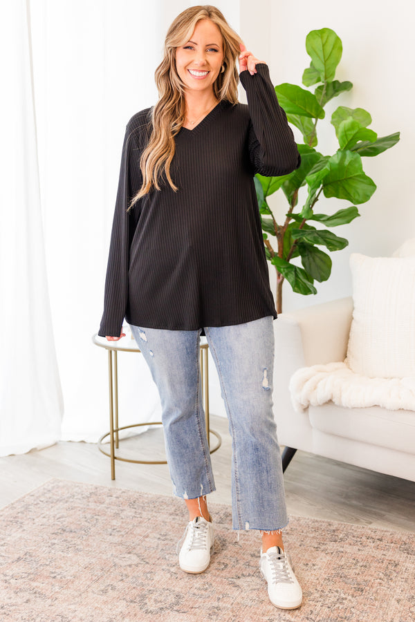 Plus Size black ribbed long sleeve top with a v-neckline and a relaxed fit.