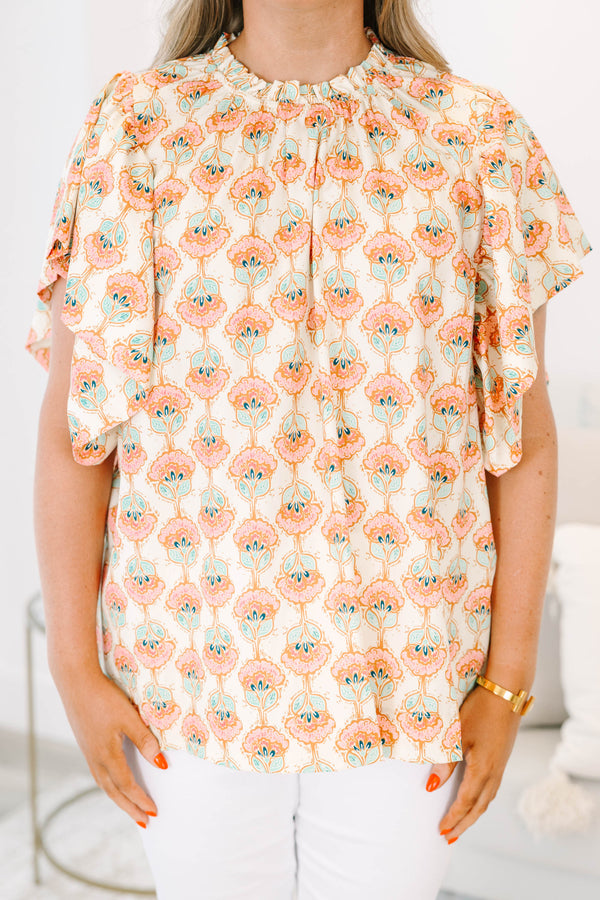 Chic Soul plus size clothing, ivory short sleeve top with light pink/teal paisley design with mock neck with ruffle sleeves