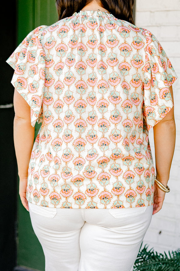 Chic Soul plus size clothing, ivory short sleeve top with light pink/teal paisley design with mock neck with ruffle sleeves