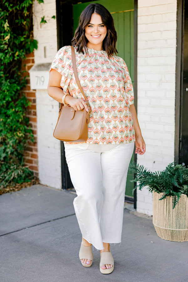 Chic Soul plus size clothing, ivory short sleeve top with light pink/teal paisley design with mock neck with ruffle sleeves
