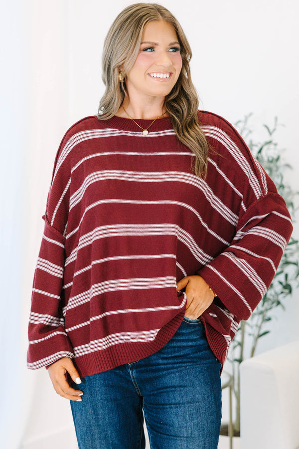 Plus Size burgundy and ivory striped drop shoulder sweater with exposed seams and a crew neckline.