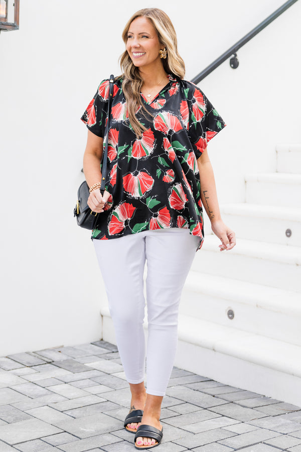 Chic Soul plus size clothing, short-sleeve black top with a split-v-neckline and a red and green abstract floral pattern 