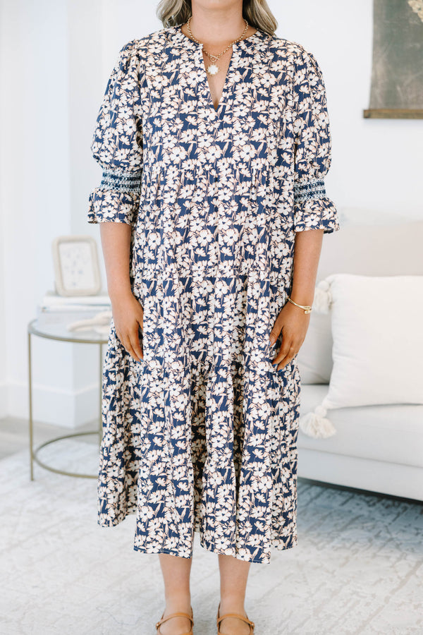 Plus Size black floral tiered midi dress with a V-neckline and three-quarter length puff sleeves.