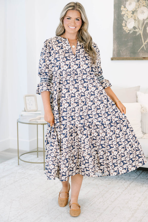 Plus Size black floral tiered midi dress with a V-neckline and three-quarter length puff sleeves.
