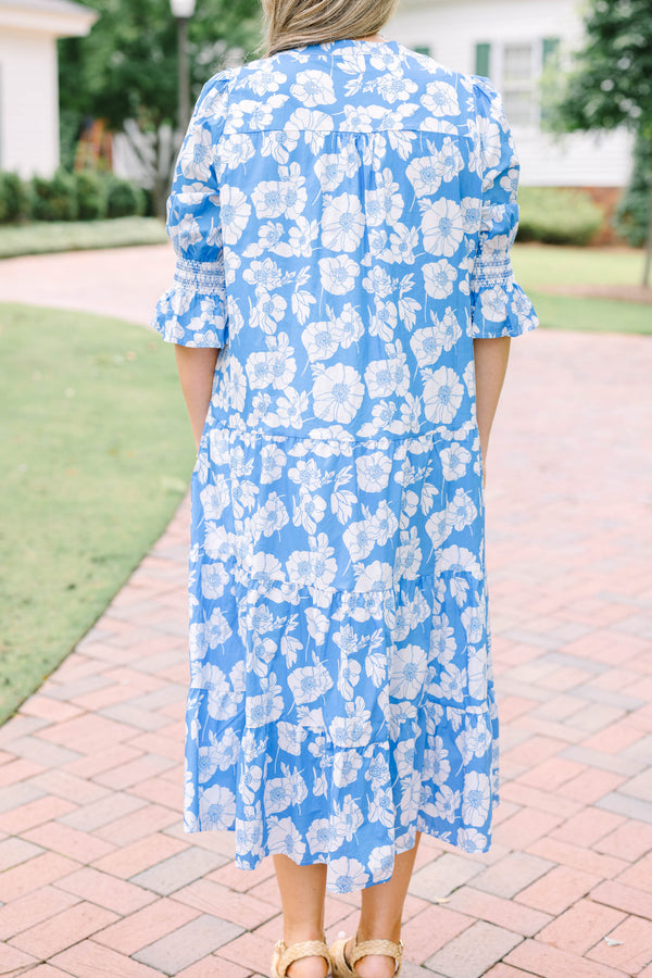 Plus Size blue and white floral tiered midi dress with puff sleeves and a V-neckline.