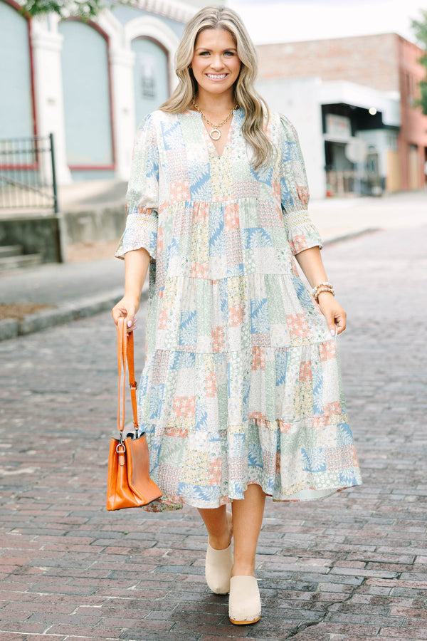 Plus size multi-color patchwork print midi dress with a flowy tiered skirt and v-neckline.