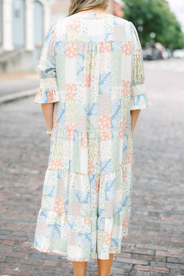 Plus size multi-color patchwork print midi dress with a flowy tiered skirt and v-neckline.