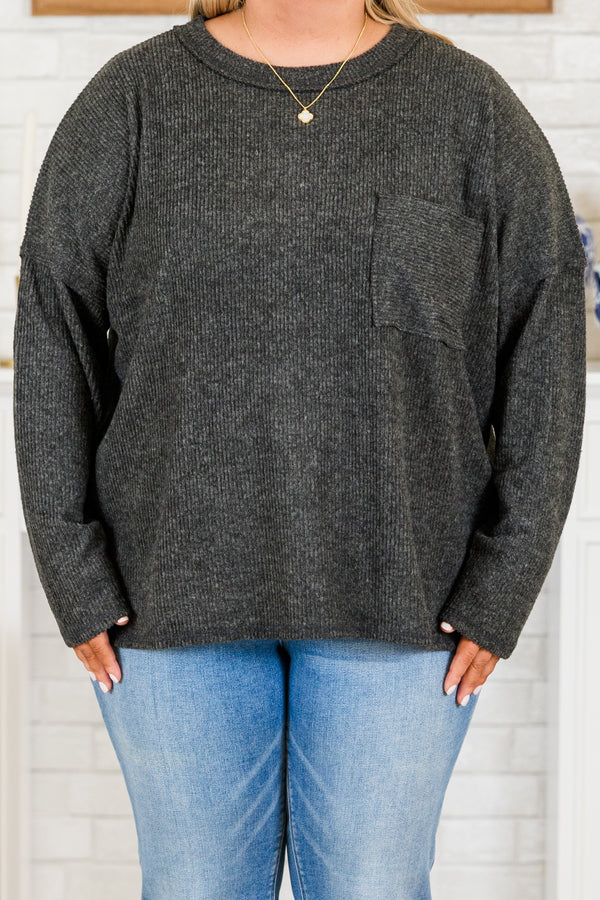 Plus Size black ribbed brushed hacci sweater with a crew neck, chest pocket, and side slits.