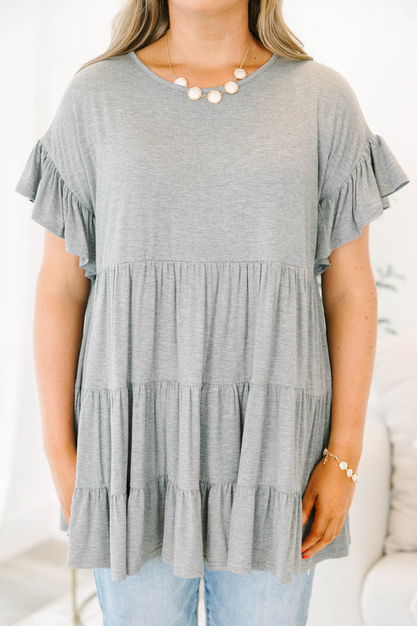 Plus Size charcoal grey tiered tunic with ruffled short sleeves and a flowy, relaxed fit.