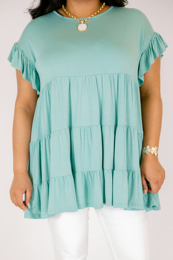 Plus Size teal tiered babydoll tunic with ruffled short sleeves and a round neckline.