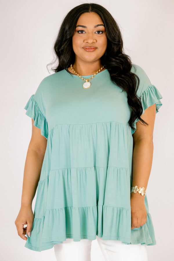 Plus Size teal tiered babydoll tunic with ruffled short sleeves and a round neckline.