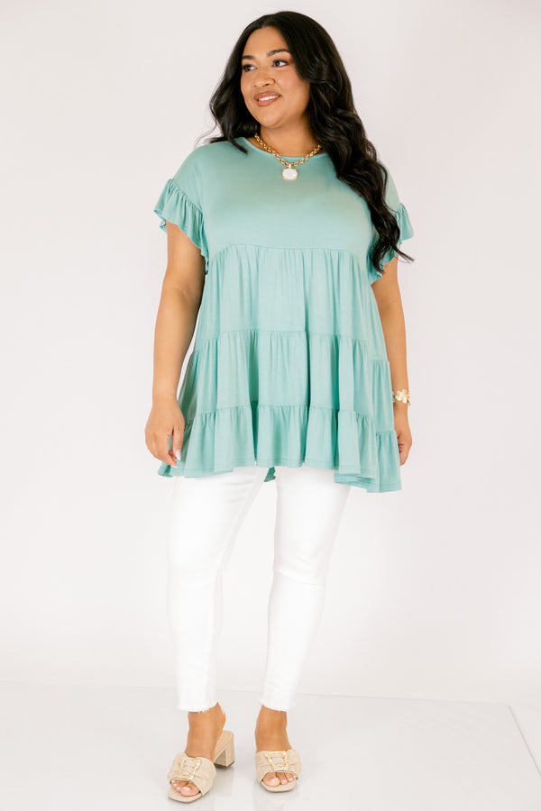 Plus Size teal tiered babydoll tunic with ruffled short sleeves and a round neckline.