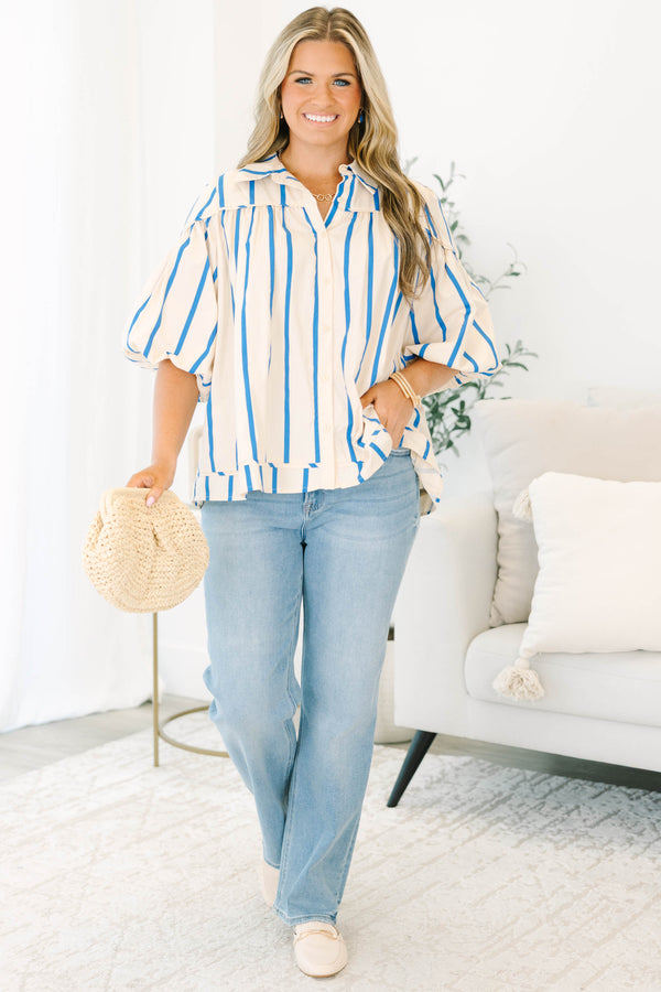 Plus size cream and blue striped button-up blouse with flowy bubble sleeves and a relaxed fit.