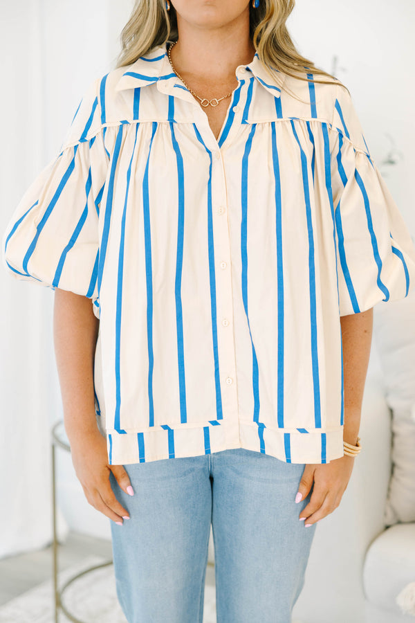Plus size cream and blue striped button-up blouse with flowy bubble sleeves and a relaxed fit.