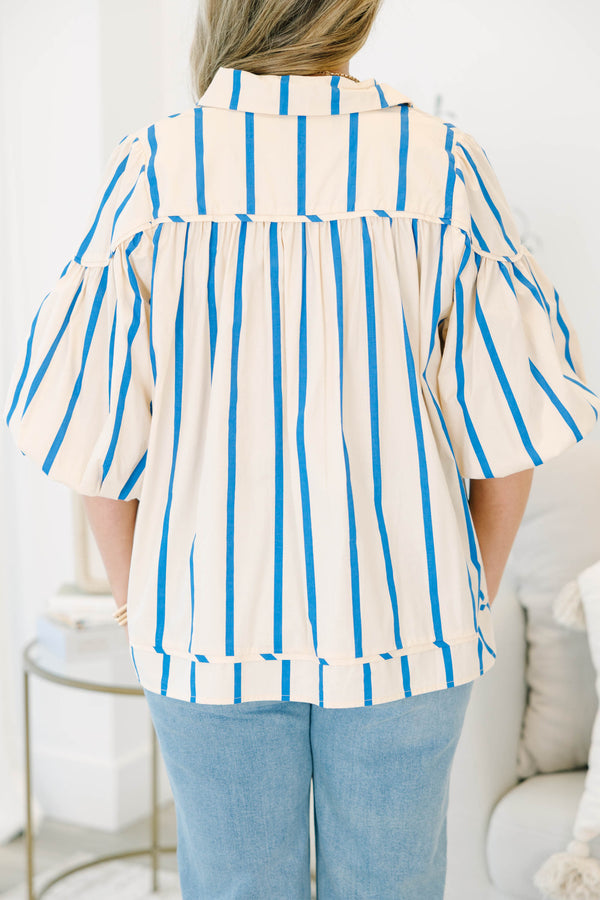 Plus size cream and blue striped button-up blouse with flowy bubble sleeves and a relaxed fit.