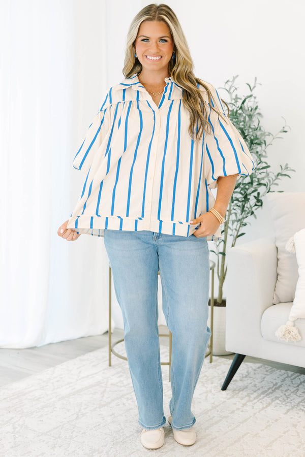 Plus size cream and blue striped button-up blouse with flowy bubble sleeves and a relaxed fit.