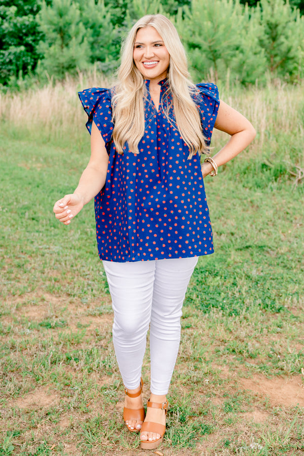 Chic Soul plus size clothing, navy short sleeve top with v cutout along neckline with collar and ruffle sleeve detail with small red apple print