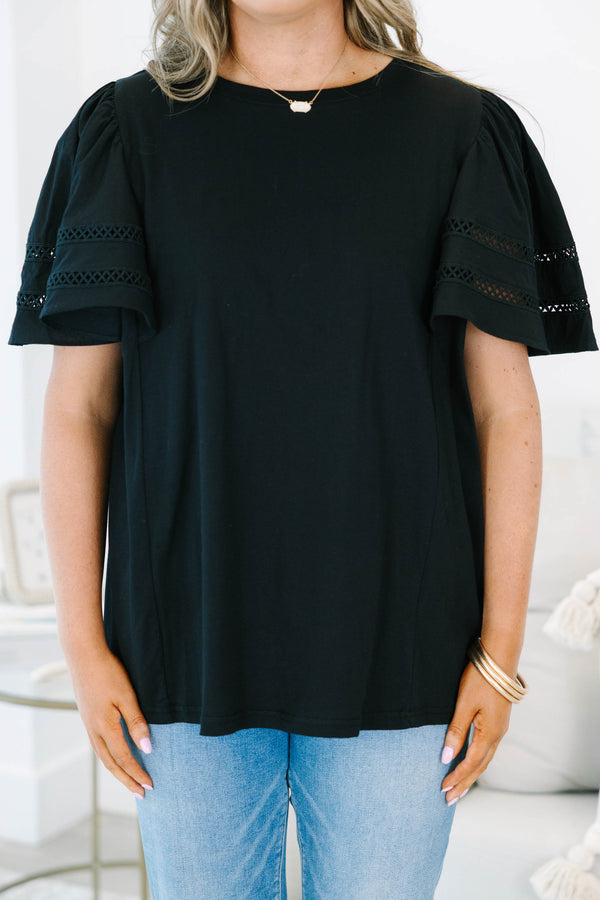 Plus size black 100% cotton top with flowy ruffle sleeves and crochet lace detailing.