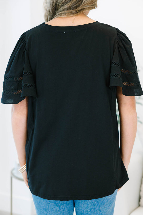 Plus size black 100% cotton top with flowy ruffle sleeves and crochet lace detailing.