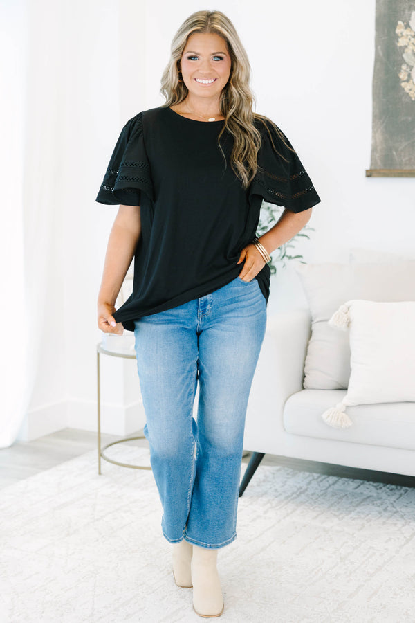 Plus size black 100% cotton top with flowy ruffle sleeves and crochet lace detailing.