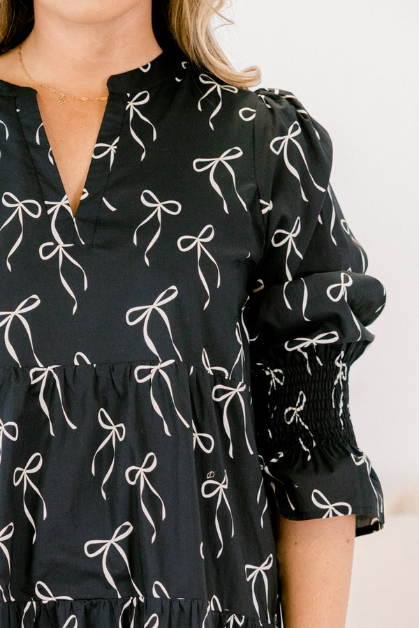 Chic Soul plus suze clothing, black midi dress with mid sleeves and v-neckline and white bow pattern