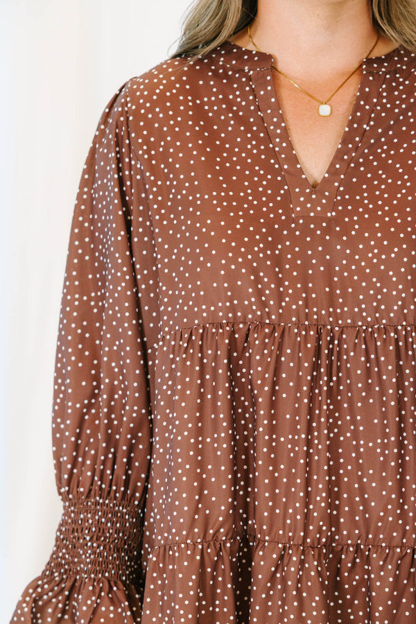 Plus Size brown polka dot tiered midi dress with a V-neckline and short puff sleeves.