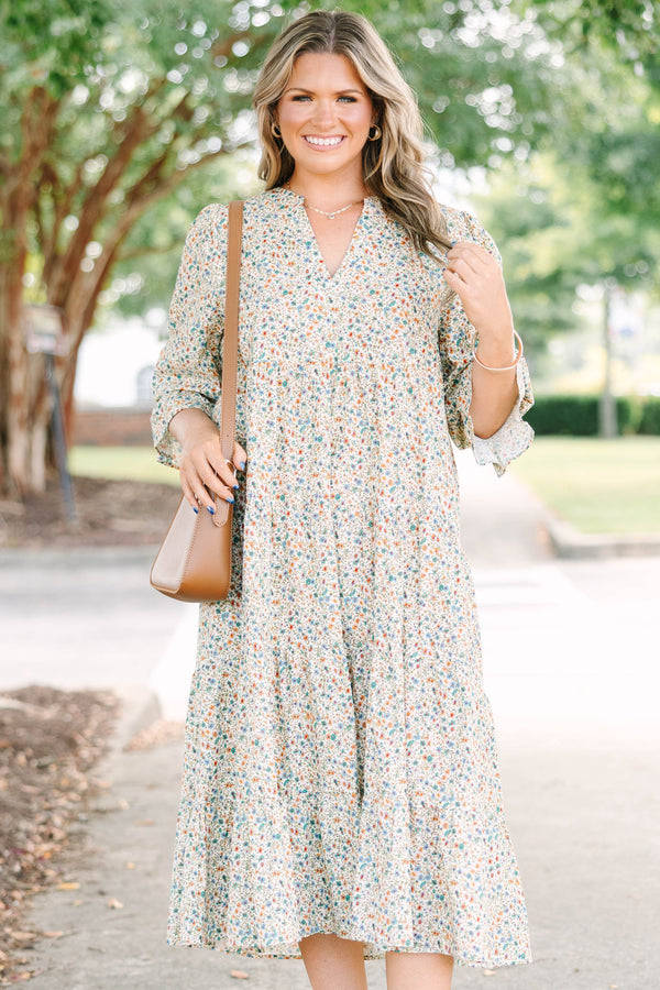 Plus Size cream floral midi dress with a ditsy print, split v-neck, and smocked cuff sleeves.