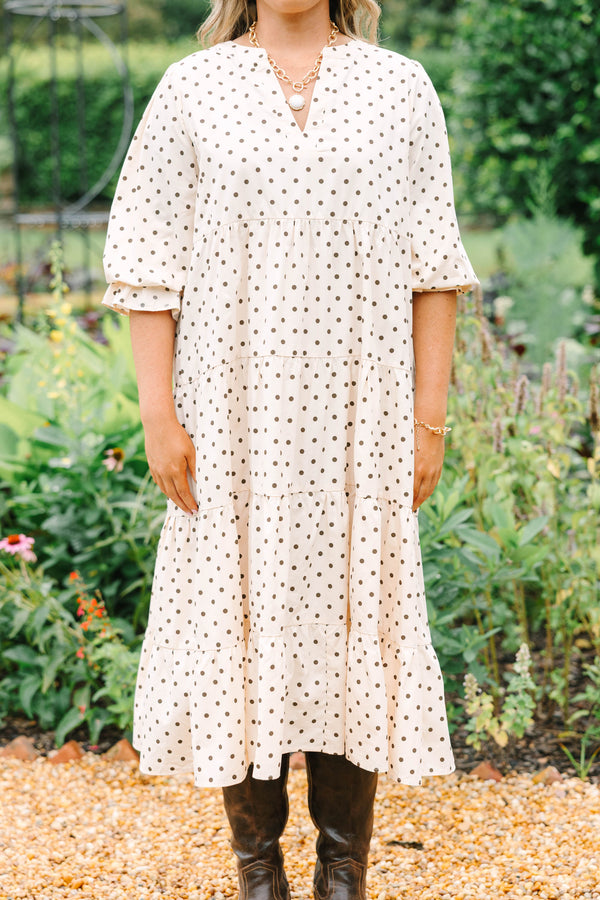 Plus Size cream tiered midi dress with brown polka dots, a V-neckline, and elbow-length sleeves.