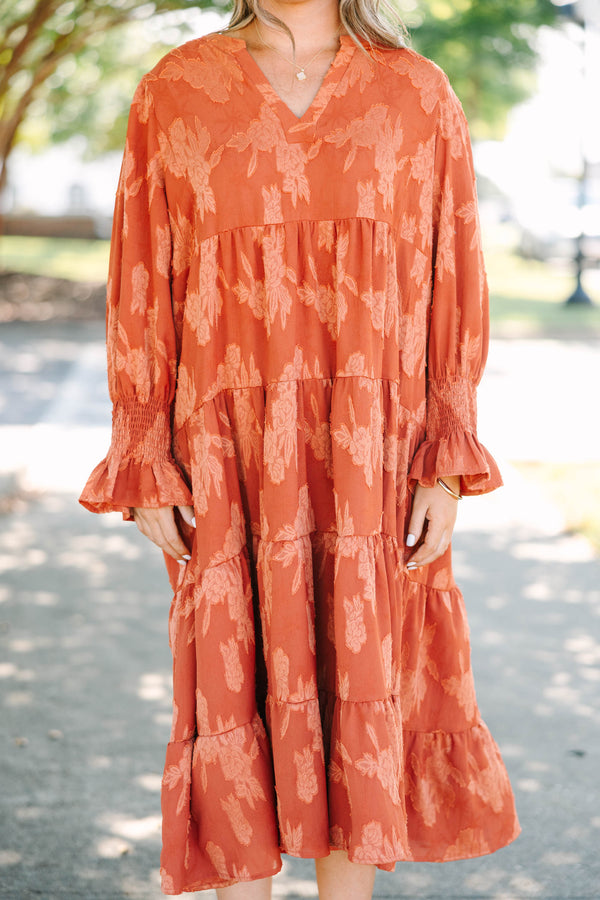 Plus Size orange tiered midi dress with a floral jacquard pattern, V-neckline, and 3/4 sleeves.