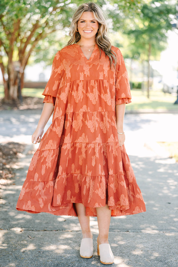 Plus Size orange tiered midi dress with a floral jacquard pattern, V-neckline, and 3/4 sleeves.